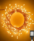 Plug In Fairy Lights 10 Feet 200 LED Copper Wire Cluster Lights Waterproof Warm White arranged in a wreath with plug