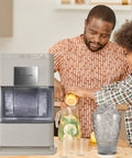 Cream Countertop Nugget Ice Maker With Visible Window And Sleek Touchscreen that cranks out ice, with family preparing drinks.