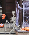 3 Foot Full Body Halloween Skeleton Decoration For Party And Haunted House in outdoor spooky decor with pumpkins and cobwebs