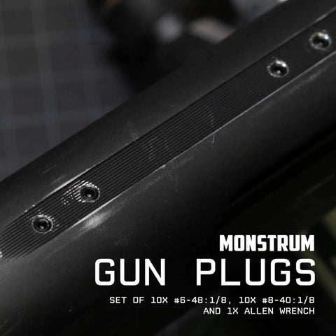 Gun Plug Screw Set For Rifle And Shotgun Receivers That Snaps Into Factory Optics Ports, showing black screws in receiver ports.