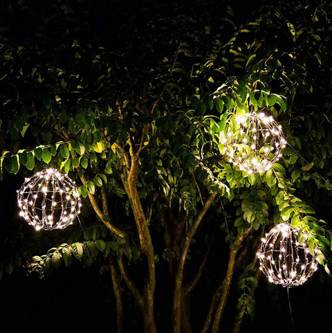 Three Pack 12 Inch LED Globe Lights For Indoor Outdoor Use Waterproof And Durable Warm White Orbs hanging on tree branches
