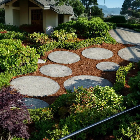 Garden walkway with concrete stepping stones made from Four Size Round Stepping Stone Molds For Concrete And Cement Garden Walkways.