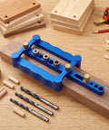 Dead Nuts Precise Aluminum Dowel Jig Kit With Self Centering Drill Guides For Flawless Furniture Assembly and Cabinet Joinery Adjustable Size Fits 20 To 65 Mm Boards displayed on wooden surface with drill bits.