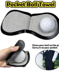 Pocket ball towel with golf ball insert, cloth interior, and hand holding the compact case, suitable for carrying on clothing.