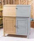 Cabinet half-painted with Chalked All In One Ultra Matte Paint In Aged Gray, One Coat Coverage, No Primer, Sanding, Or Topcoat Needed