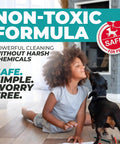 Child playing on floor with dog, promoting Non-Toxic Formula for safe, powerful cleaning without harsh chemicals.
