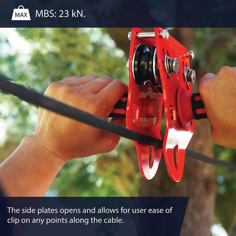 Heavy Duty Zipline Trolley With Stainless Steel Sheaves And Double Pulley, 23kN Rating, held by hands in outdoor setting