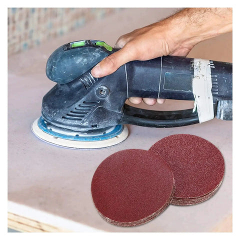 Top Tier 50 Piece 6 Inch Hook And Loop Sanding Discs With Dust Vent Holes For Smooth Wood Metal Carving And Finishing Projects Using Aluminum Oxide Abrasive Grit Range From 80 To 3000 For Pro Grade Results, being used with an orbital sander.