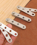 4 Piece Stainless Steel 360 Degree Concealed Door Hinges Set displayed on wood and leather surface