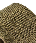Close-up of fireproof pipe wrap insulation webbing for furnace flue protection, showing detailed woven texture.