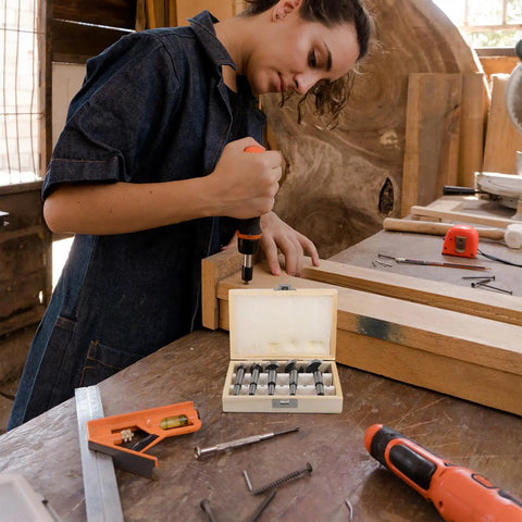 Top Rated Five Piece Forstner Drill Bit Set Round Shank Multi Tooth Design For Precision Woodworking, shown during use on a wood project.