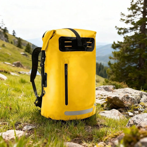 Yellow waterproof hiking backpack with PVC construction large capacity daypack in a scenic outdoor setting