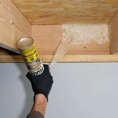 Applying Premium Closed Cell Spray Foam Insulation Can With Wide Trigger Sprayer for seamless attic sealing.