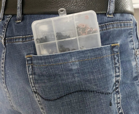 1000Pcs Universal RC Screw Kit With 304 Stainless Steel Screws in transparent storage box in back pocket of jeans