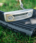 Classic Blade Putter with CNC Machined Face for Precision, showcased with club cover on grass for confident putts on every hole