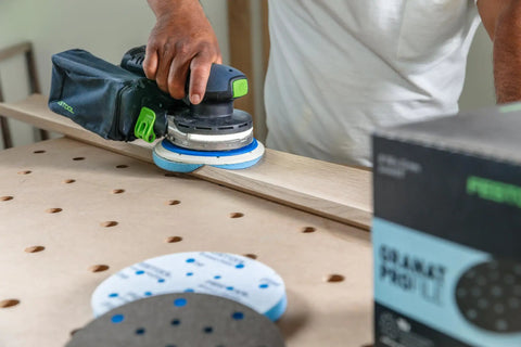 Person using Granat Profile Soft 6 Inch Sanding Discs 10 Pack For Contours Curves And Moldings With Flexible Foam Backing