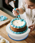 Person using All In One Cake Decorating Starter Kit With Non Slip Turntable Leveler And 82 Piece Baking Gear Including Piping Tips Icing Bags