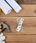 Hidden Rotation Pivot Hinges Set on wooden surface with tools, 360 Degree Concealed Door Shaft For Secret Doors And Cabinets, Stainless Steel
