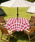 Round 60 Inch Outdoor Tablecloth With Umbrella Hole And Zipper, Red And White Gingham, Spill Proof And Washable on patio table