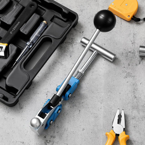 Tough Center Punch Bander Tool For Snug Hose Connections with quick install adapter on work surface with additional tools.