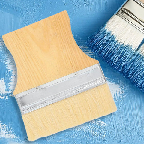 Three Piece Flat Wool Brush Set With Poplar Wood Handles For Deck Stain And Furniture Paintwork, top view on blue background