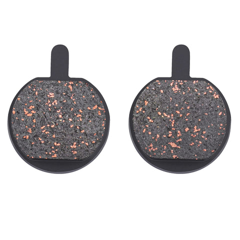 Pair of round bicycle disc brake pads with copper flecks, front view
