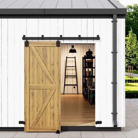 Exterior view of a barn with Built Tough Heavy Duty 6Ft Box Rail Barn Door Hardware Kit, sliding wooden door mounted.