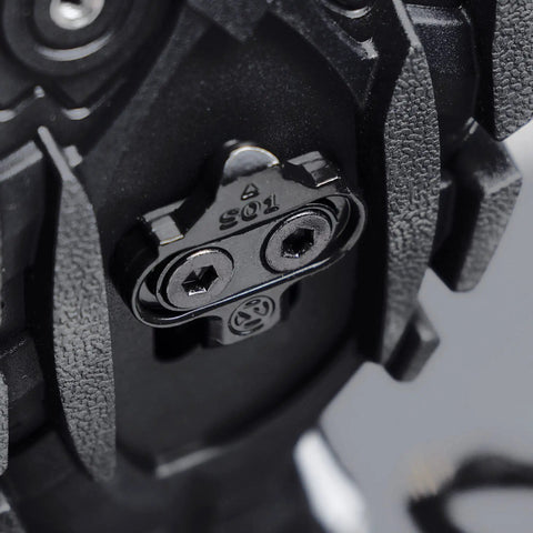 Close-up of SPD Pedal Adapters For Peloton Turn Look Delta Pedals Into SPD Toe Clip Cages With Cleats Included on bike pedal
