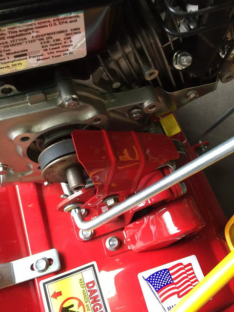 Close-up of a red reel mower engine assembly, featuring a drive belt area; related to Reel Mower Drive Belt Replacement 1060 19.5 Inch Length 4L195 Fits Mclane 20 And 25 Inch Models Heavy Duty Oil Treated Static Dissipating Commercial Grade For Longevity Premium Replacement Part With Easy Install For Long Lasting Performance