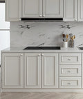 Kitchen with fresh brushed nickel knobs on white cabinets, sleek design fitting any kitchen makeover, enhances style.