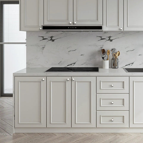 Kitchen with fresh brushed nickel knobs on white cabinets, sleek design fitting any kitchen makeover, enhances style.