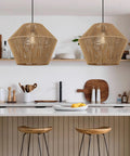 Handwoven Rattan Pendant Light With Woven Basket Shade hanging above kitchen island.