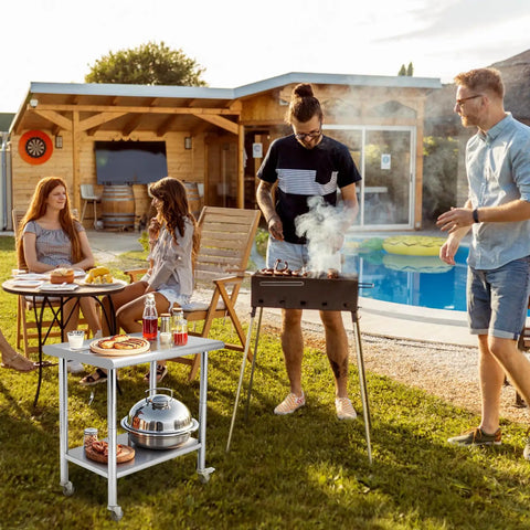 Outdoor barbecue scene with Mobile 30 By 24 Inch NSF Stainless Steel Workbench With Four Wheels And Hooks by a pool.