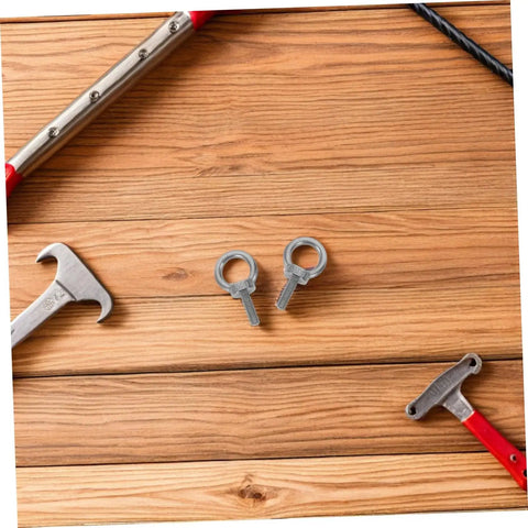 M6x20 Stainless Steel Eyebolts With Closed Ring And Hole For Concrete Anchoring, Beefy Heavy Duty Eye Screws With Nylon Nuts For Vibration Dampening, Super Secure Mounting For Hooks, Decor, And Industrial Projects. Close-up on two M6 eyebolts