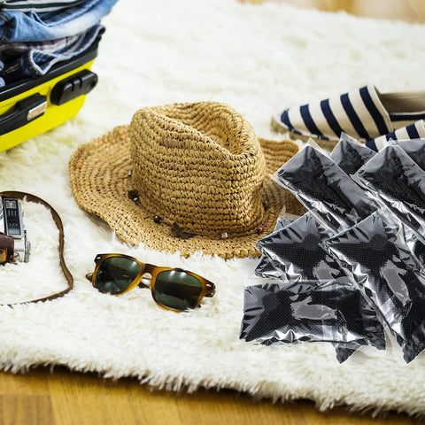 Travel essentials including sunglasses, hat, and 100-Piece Women Disposable Underwear Set With Disposable Bras And Black Thong Panties