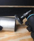 Person using Two Inch 120 Grit Zirconia Aluminum Oxide Sanding Discs Set on metal, showing low vibration and fast cutting.