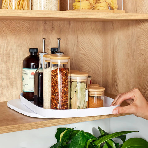 Rectangle Lazy Susan Turntable for Cabinets and Pantries, 360 Degree Spin Kitchen Organizer in use with spice jars on wooden shelf