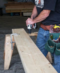 Dead Simple 4 Inch Framing Screws With Low Profile Head and Boss Level Sawtooth Point For Fast Track Wood Projects in use by a worker.