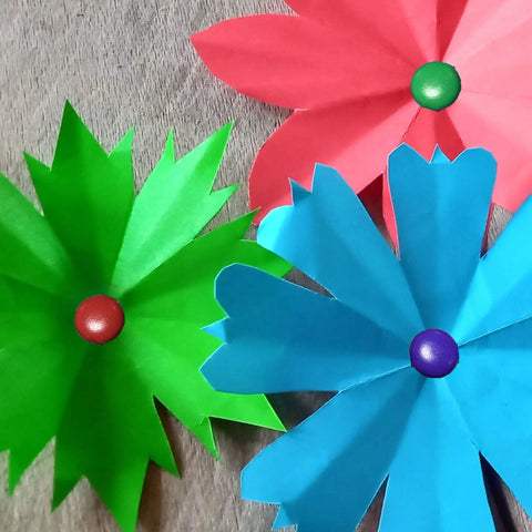 Assorted Color Round Head Craft Brads 200 Pack Top Tier Plated Metal Fasteners For Scrapbooking Reliable Document Stems. Green, blue, and pink paper flowers with brads.