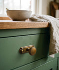 Killer Style Beaded Zinc Alloy Cabinet Knobs With Backplate Antique Brass 6 Pack for kitchen cabinets on green drawer.