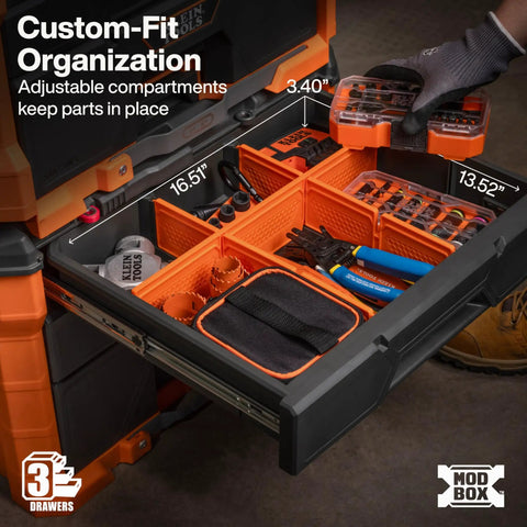 Top drawer of Modbox Three Drawer Rolling Toolbox With Ball Bearing Slides, filled with tools and accessories, customizable compartments