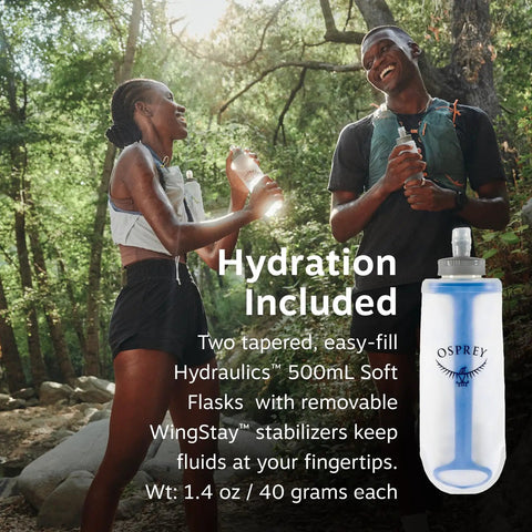 Two people wearing Dyna LT Womens Running Hydration Vest With Hydraulics Soft Flasks, Black Medium, in forest setting