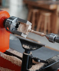 NCK Series Quick Change Woodturning Lathe Jaws For Pipe And Spoon Making in action gripping a wooden piece on a lathe