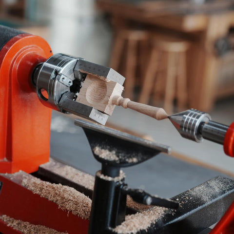 NCK Series Quick Change Woodturning Lathe Jaws For Pipe And Spoon Making in action gripping a wooden piece on a lathe