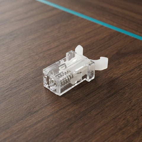 Push Button Trash Can Latch Lock For Your Ride, Flat Matte Plastic Design, Wear Resistant Lid Clip on wooden surface