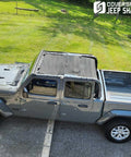Installed Coverspec JT top sun shade on Jeep Gladiator four-door; black mesh sunshade blocks UV, full-length.
