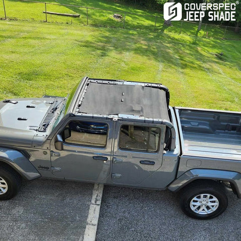Installed Coverspec JT top sun shade on Jeep Gladiator four-door; black mesh sunshade blocks UV, full-length.