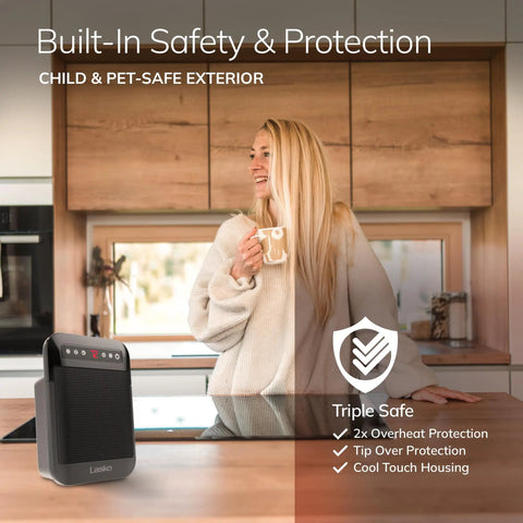 Cozy Up With MyHeat Max Portable Ceramic Space Heater For Indoor Use With Tip Over Switch next to delighted woman in kitchen