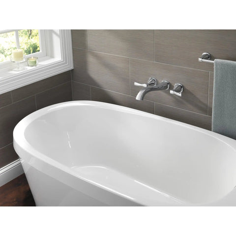 Modern bathroom with freestanding tub and wall-mounted faucet