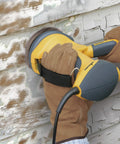 Person using PaintEater Electric Palm Grip Paint Removal Sander Kit For Easy Paint Stripping On Wood And Metal on old siding.